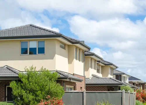 A modern townhouse built by Gurzora Homes, illustrating quality construction and stylish design.